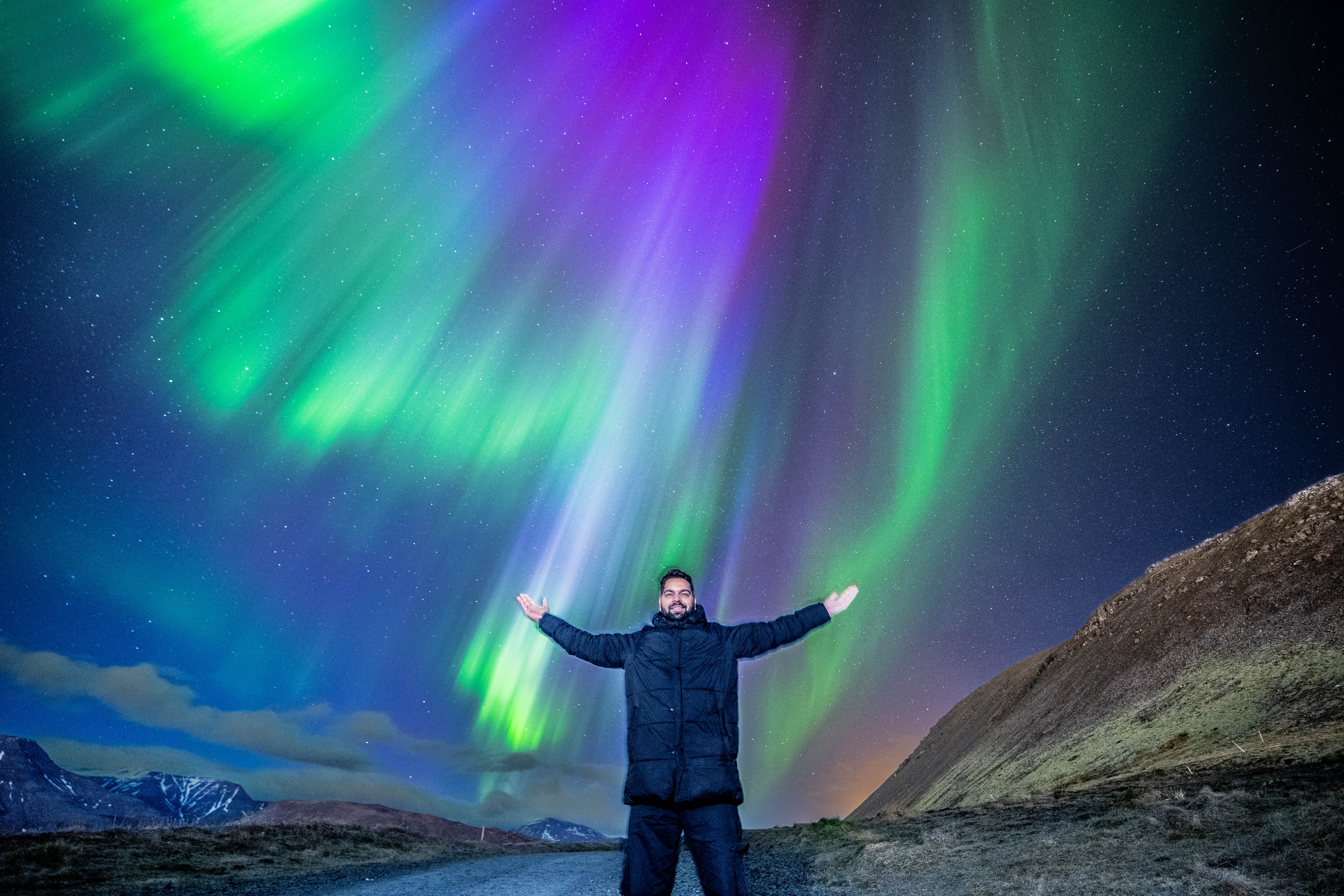 Mercedes Sprinter parked under the aurora glow